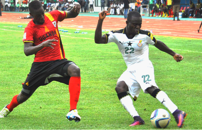 Black Stars’ Frank Acheampong (22) gains the upper hand in this midfield action with Ugandan defender, Juuko Murushid Black Stars’ Frank Acheampong (22) gains the upper hand in this midfield action with Ugandan defender, Juuko Murushid